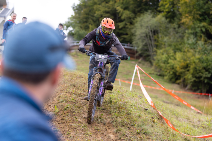 A man is riding his mountain bike on a hiking trail.