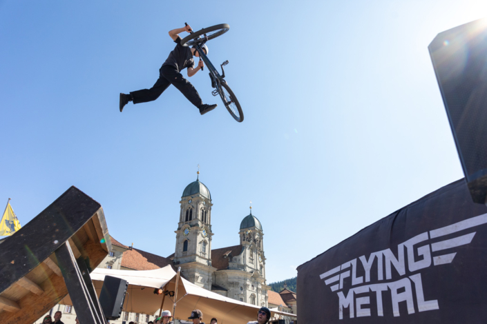 A man rides a bicycle in the air.