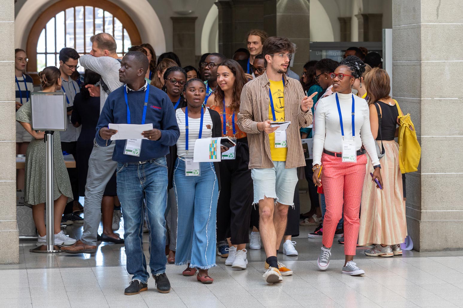 A group of people standing in a row.