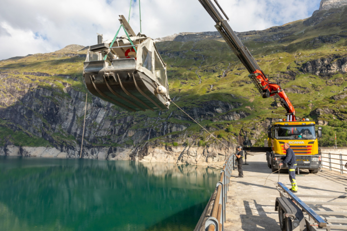 A crane lifting a boat.